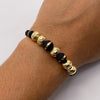 Pulsera tejida Bolas diamantas 8mm con neoro una raya 8mm y 6mm una raya  Oro amarillo 18k 1,15 Gr