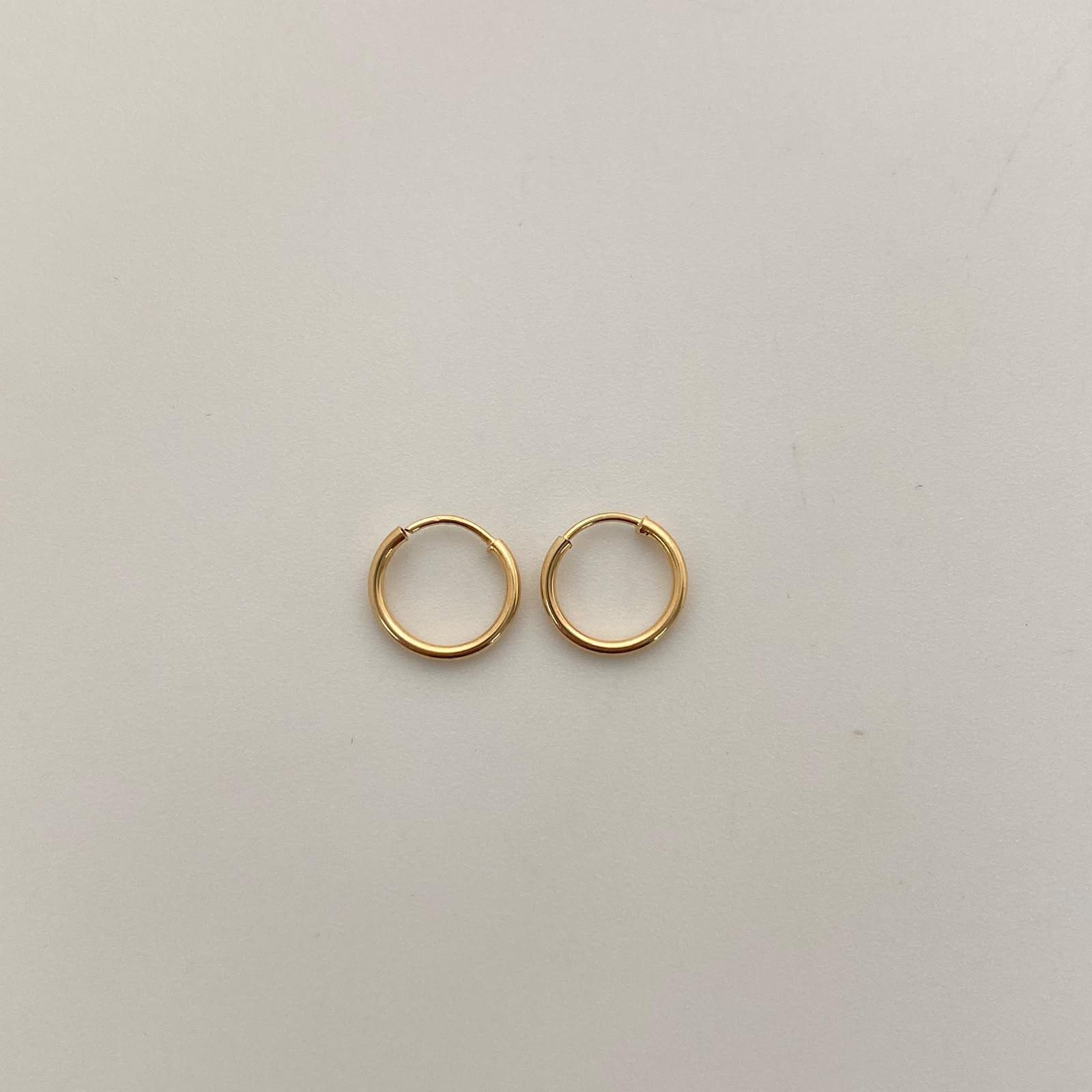Candonga imperdible lisa Oro amarillo 18k 0,35 Gr / 0,8 Cm