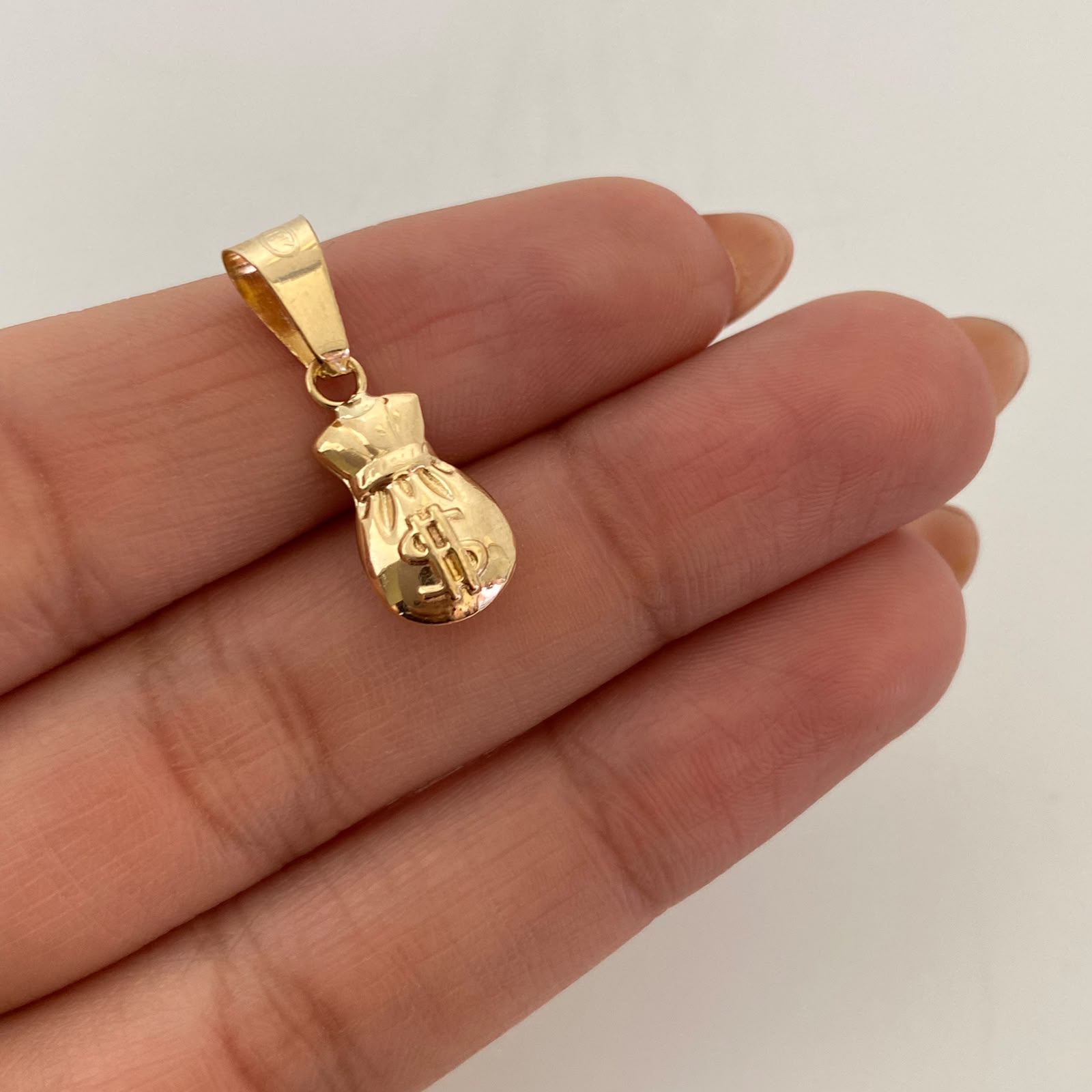 Dije Bolsa de Valores Oro amarillo 18k 0,75 Gr / 8,2 mm / 2,2 Cm