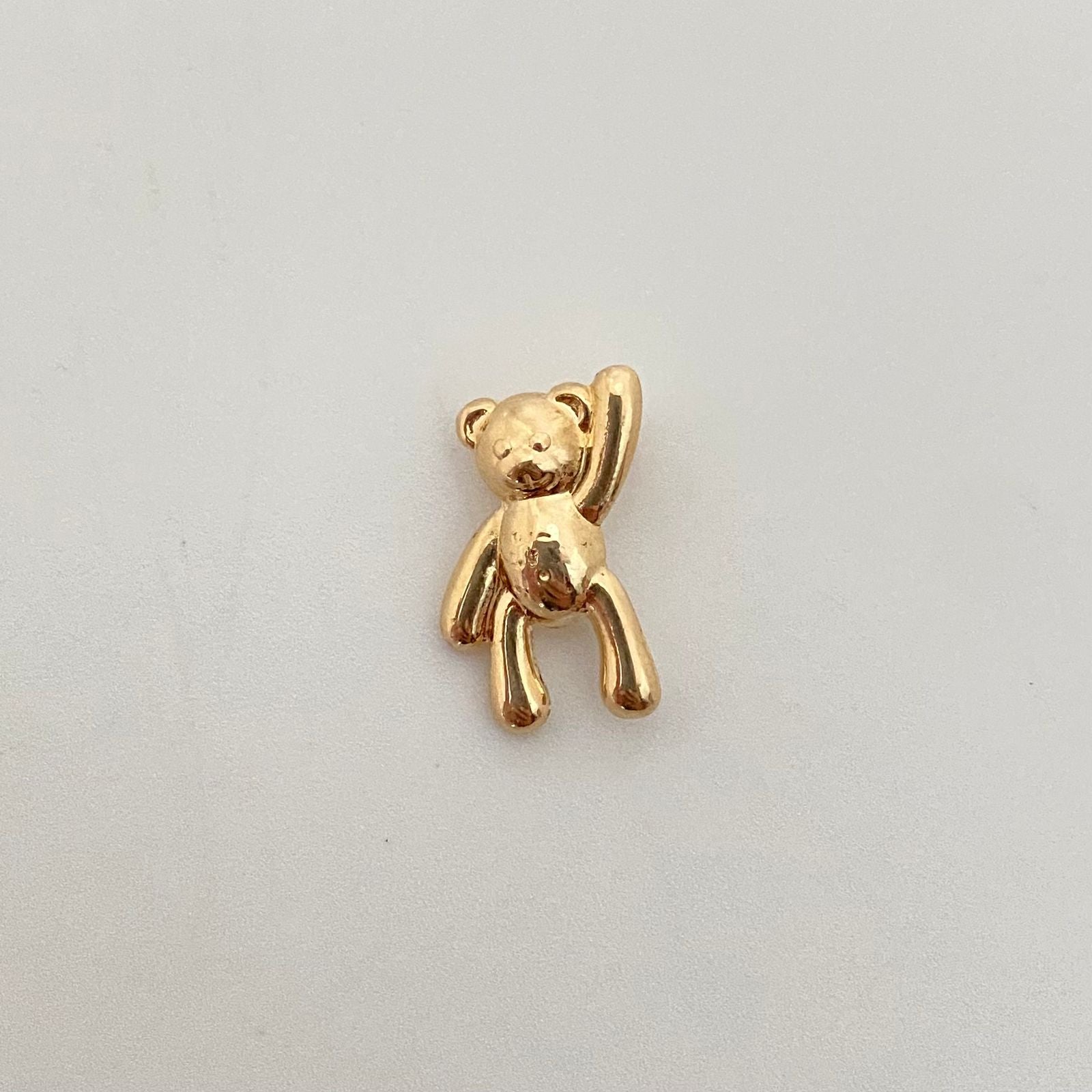 Dije oso mano alzada Oro amarillo 18k 0,90 Gr / 1,4 Cm