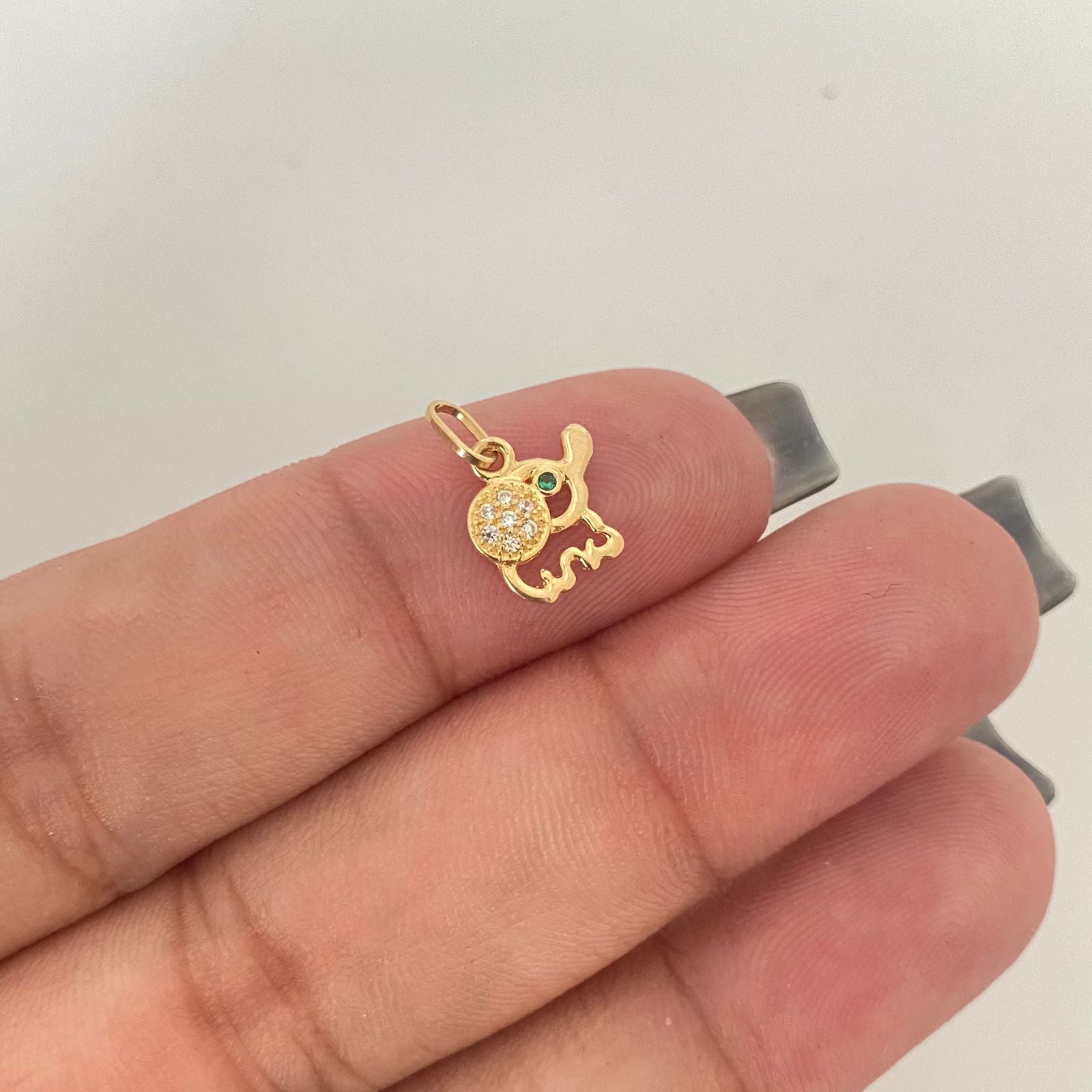 Dije silueta elefante casting punto verde Oro amarillo 18k 0,50 Gr / 1,3 Cm