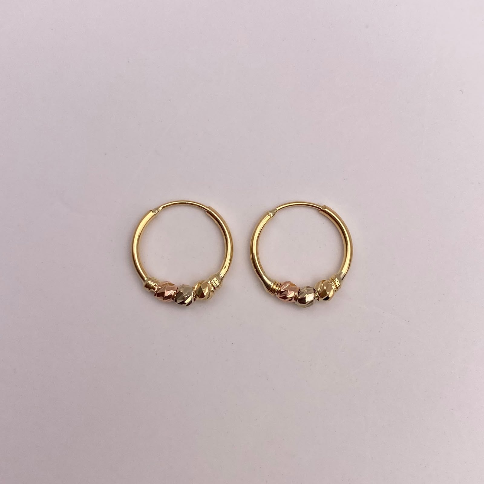 Candonga imperdible bola diamantada Tres oros 18k 0,92 Gr / 1,2 Cm